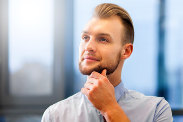 Portrait of a friendly businessman in his office