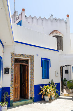 Traditional white and blue washed houses in side alley of historical Moroccan town Asilah, Morocco, North Africa