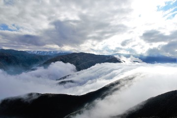 View over the clouds on top of the hill Cerro Arco close to Mendoza in Argentina, South America