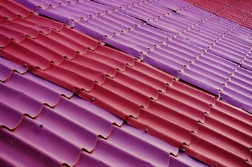 Red and pink geometric metal roof shingles