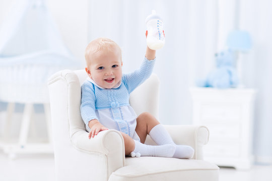 Baby Boy With Bottle Drinking Milk Or Formula