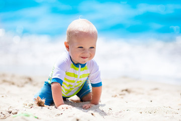 Baby boy on tropical beach