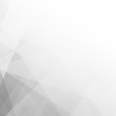 Obraz premium An abstract geometric background featuring overlapping white and gray polygonal triangles with a subtle texture and modern pattern.