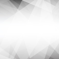 Obraz premium This abstract geometric background features overlapping white and gray triangles and polygons that create a modern gradient effect with depth.