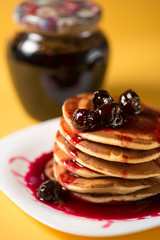 Home fluffy pancakes with cherry cherries