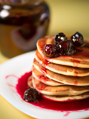 Home fluffy pancakes with cherry cherries