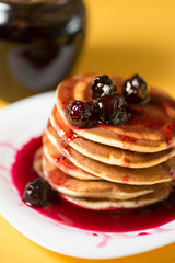 Home fluffy pancakes with cherry cherries