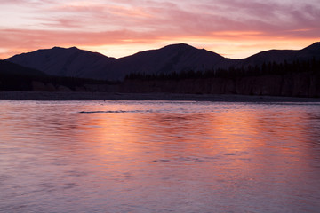 Red light from the sunset in the valley. River Omulevka. Yakutia. Russia.