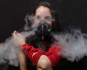 cyber goth girl with gas mask isolated on a dark background