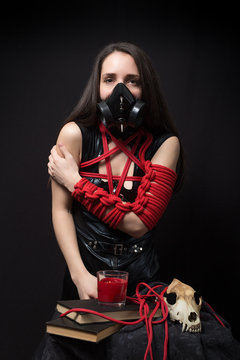 cyber goth girl with gas mask isolated on a dark background