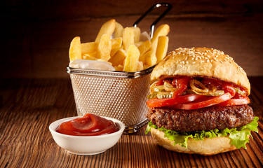 Fresh beef burger with basket of French fries