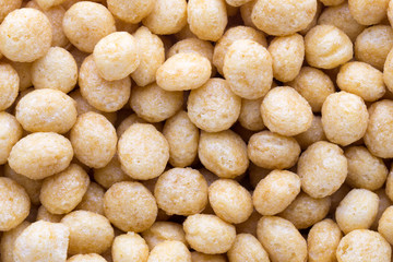 Corn flakes rings on the background.