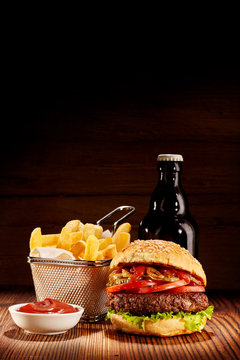 Pub Burger Meal With Fries And Beer Bottle