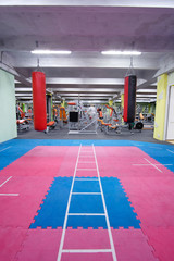 Obraz premium Interior of a fitness hall with punching bags
