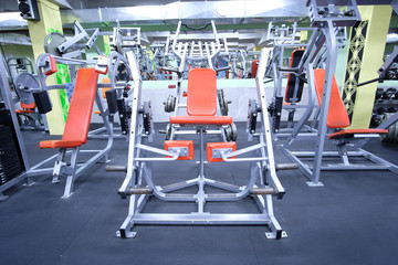 Fototapeta na wymiar Interior of a fitness hall with fitness equipment