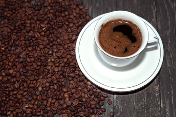 Coffee cup with coffee beans.