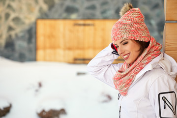 winter, leisure, sport and people concept - happy young woman in