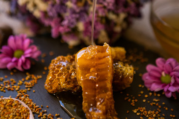 natural honeycombs and pollen on table.