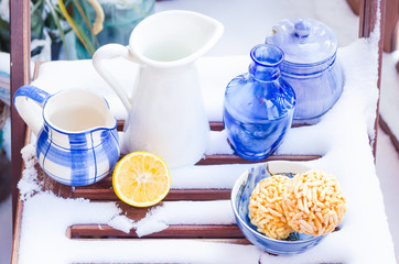 Cozy Scene with Vintage Blue Cups, Vases, Decanters in the Snow