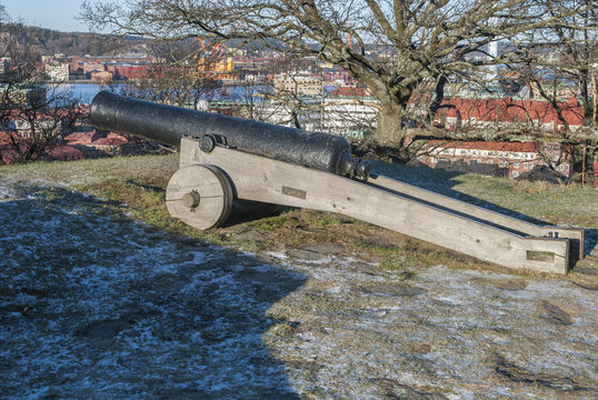 Old cannon with Gothenburg in background, travel Sweden