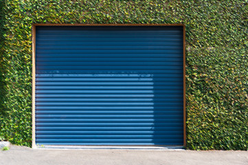 Green grass wall with garage door