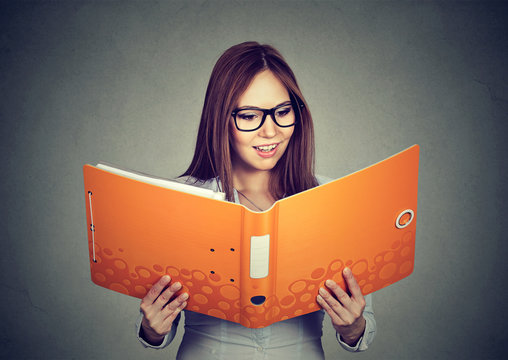 happy smiling business woman with orange folder