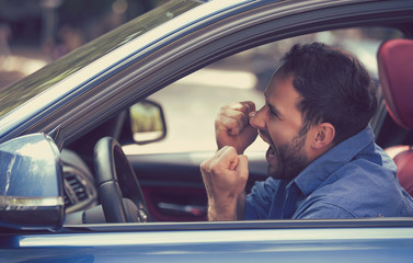 angry driver with fists up screaming