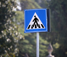 road sign warning pedestrian crossing in the city