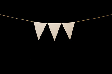 Bunting, three white triangles on string for banner message