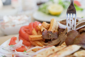 Turkish doner, Greek gyros, meat, fried potatoes, tomatoes and onions, Athens Greece, national food, traditional Greek cuisine,doner
