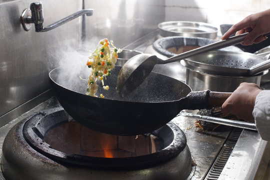 Close Up Of Working Chef Preparing Chinese Food