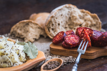 Farmer's Breakfast. Sausage, Sour Cabbage and Bread. Raw Ingredients.