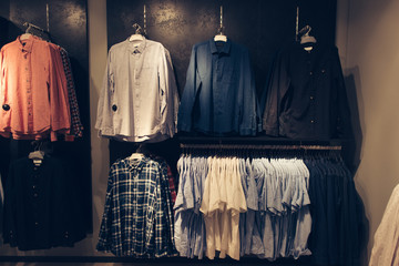 Shirts in men's clothing store. Shopping concept