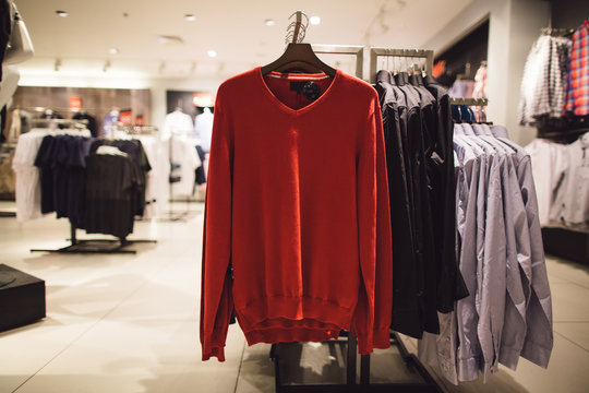 Spring Red Men's Sweater In Men's Clothing Store. Shopping Concept