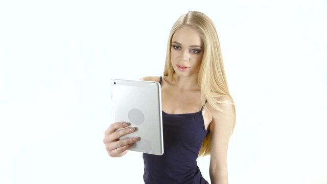 Selfie photo blonde girl who makes it to tablet online