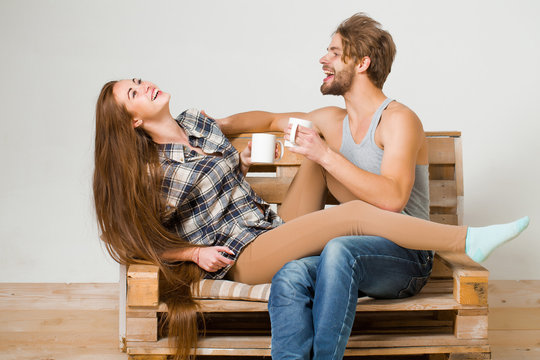young couple on wooden sofa