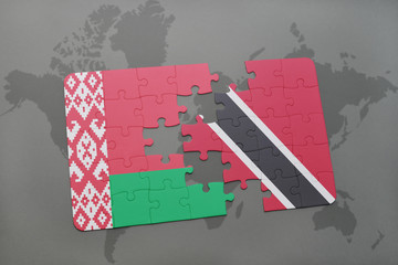 Fototapeta na wymiar puzzle with the national flag of belarus and trinidad and tobago on a world map