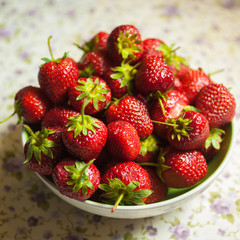 red strawberry heap in plate