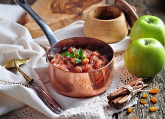 Homemade apple chutney with raisins, cinnamon, chili and other spices. © chudo2307