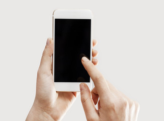 Hands holding mobile phone