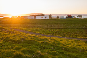 Little houses on Flatey island in Iceland at midnight