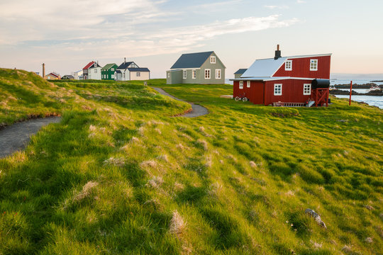 Little houses on Flatey island in Iceland at midnight