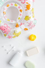 baby accessories for bath with duck on white background