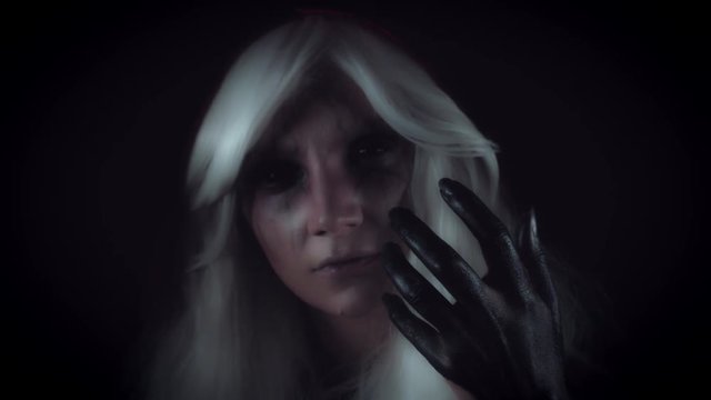4K Horror Witch Gesturing with Hand and Appearing from Darkness