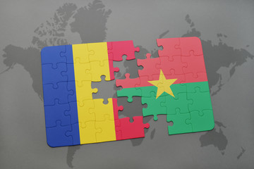 puzzle with the national flag of romania and burkina faso on a world map