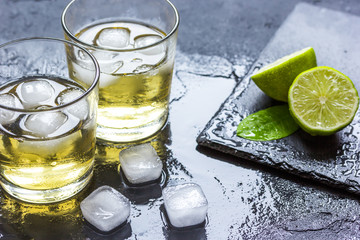 glass of whiskey on dark background