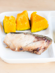 Japanese cuisine, a piece of sliced and grilled yellowtail
