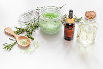 organic cosmetics with extracts of herbs rosemary on white background