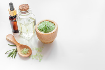 organic cosmetics with extracts of herbs rosemary on white background