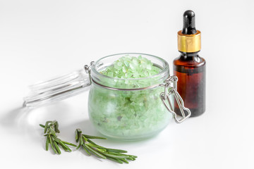 organic cosmetics with extracts of herbs rosemary on white background